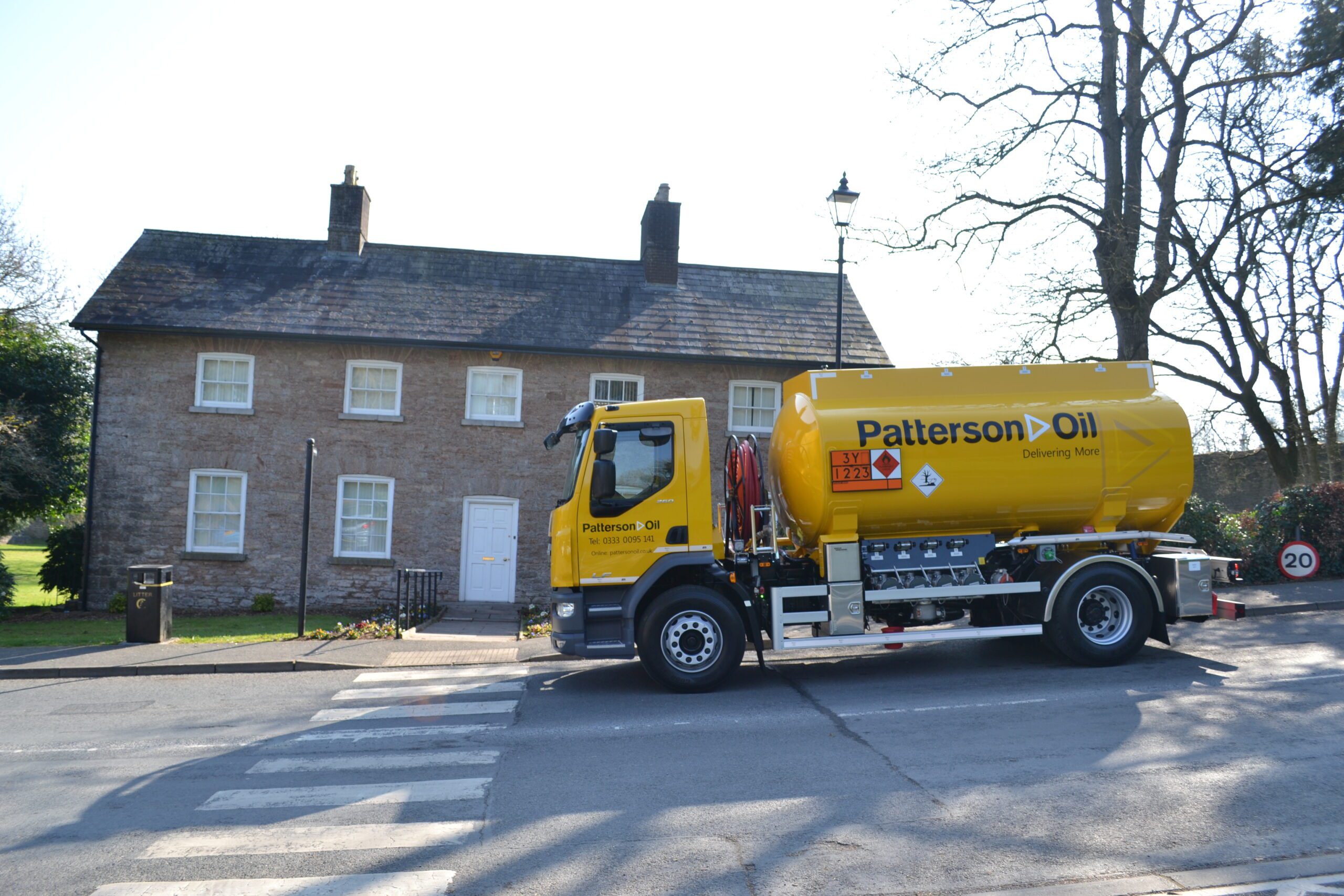 A modern yellow Patterson Oil delivery tanker